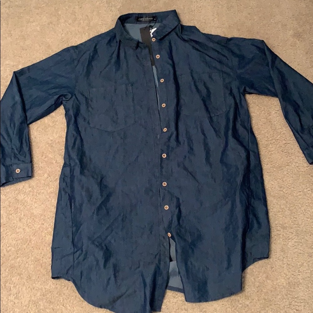 Women’s long denim button up cardigan or dress.